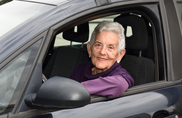 senior woman driving a car