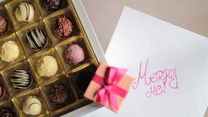Chocolate candy box and a box with engagement ring
