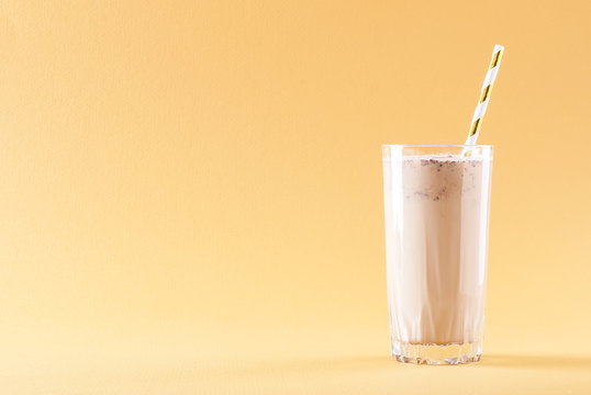 banana chocolate smoothie on a solid background