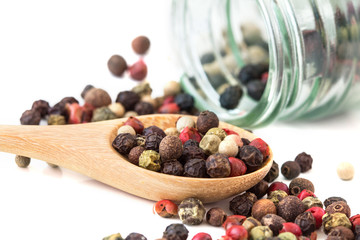 Close up mixed type of the peppercorns in wooden spoon
