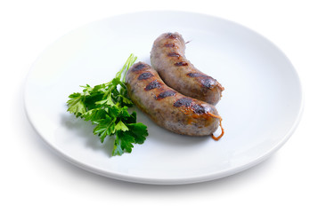 Grilled homemade liver sausage on white plate