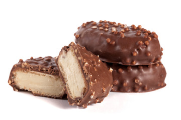 chocolate candy with white cream filling isolated on white background