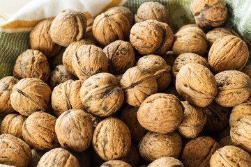 Walnut. Walnut in the shell. Background. Selective focus.