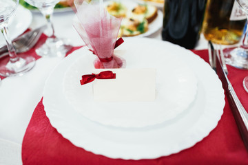 The sweets and paper standing on the plate