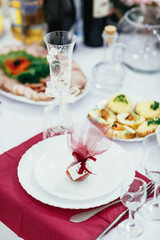 The sweets and paper standing on the plate