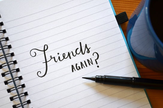 "Friends again?" written in notebook on desk