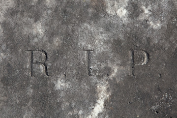 RIP. Rest in peace. Traditional inscription on the grave.
