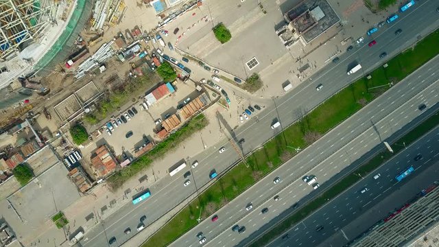 City highway and urban construction site aerial top down view. 4K video