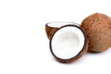organic ripe coconuts, whole and halved isolated on white
