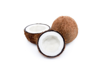 organic ripe coconuts, whole and halved isolated on white