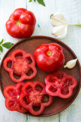 Fresh red tomato on a plate