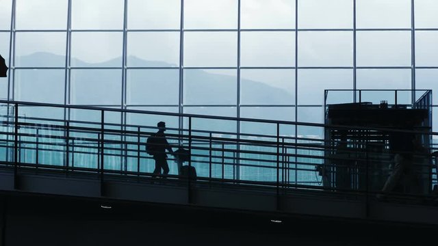 Silhouettes of Commuter in Airport.
People in airport. 
