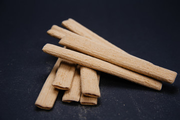 Close up creamy sticks biscuits. Delicious and tasty biscuits, cookies on black background.