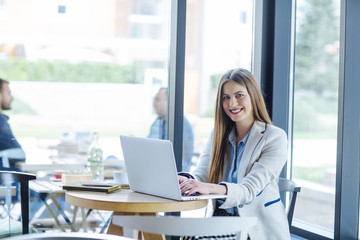 Beautiful Young Woman Working on Laptop