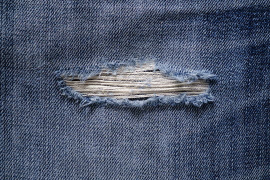 striped texture on vintage used jeans denim background.