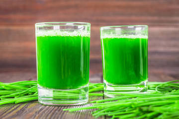 Wheatgrass shot. Juice from wheat grass. Trend of health