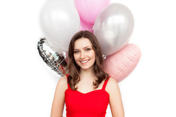 Fototapeta na wymiar Lovely girl posing with balloons