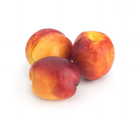 Nectarines on a white background