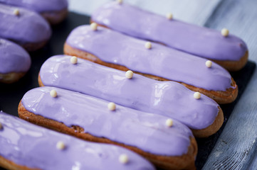 Eclairs, filled with purple frosting.A work of culinary art