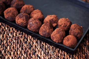 A lot of delicious round chocolate truffles. A work of culinary art