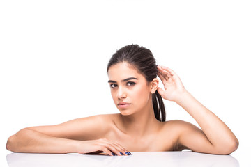 Fototapeta premium Beautiful face of young adult woman with clean fresh skin isolated on white