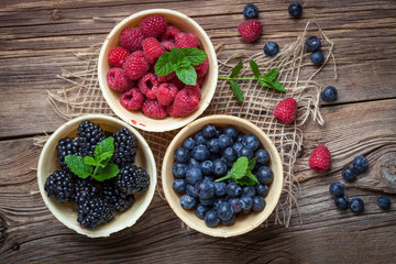 Blackberries, raspberries and blueberries in a waffle bowls.