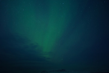 Fototapeta na wymiar Aurora Borealis (Northern Lights) above coastal sea