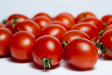 Two tomatoes, isolated on white background