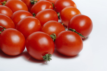 Two tomatoes, isolated on white background