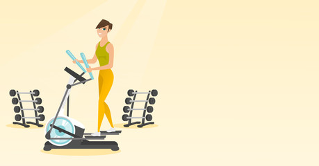 Woman exercising on elliptical trainer.