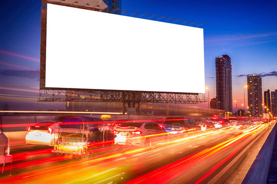 large billboard in the night traffic jam