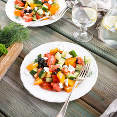 Homemade salad with vegetables and soft goat cheese. Healthy food, diet, detox, clean eating concept. Selective focus.
