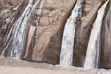 The Augrabies falls during flood-time along the  Orange river canyon at the Augrabies Falls National Park  During floods the excess water floods down the walls of the gorge ion spectacular fashion.
