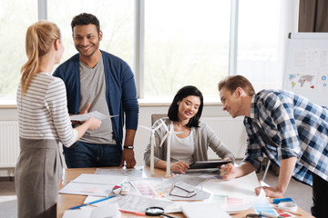 Delighted happy team of engineers enjoying their work