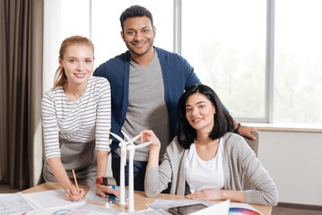 Obraz premium Joyful nice engineers looking at you