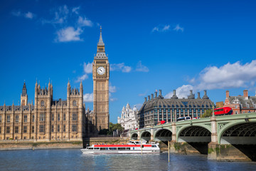 Big Ben and Houses of Parliament with boat in London, England, UK