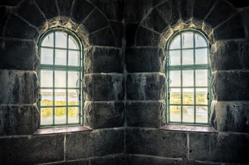Fototapeta na wymiar Old castle inside, with nature window view