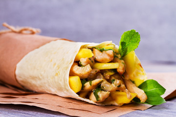 Chicken wraps with mango, basil and mint. Burrito with chicken