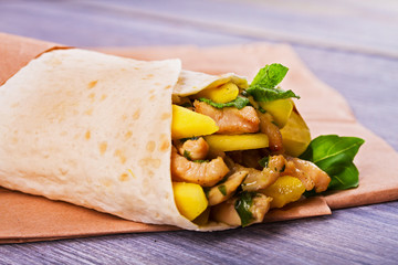 Chicken wraps with mango, basil and mint. Burrito with chicken