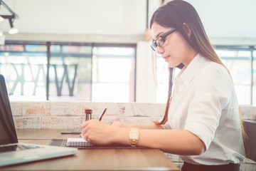 A business woman working on the laptop at the office