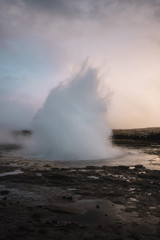 Beautiful geyser valley in Iceland.Erupting geyser
