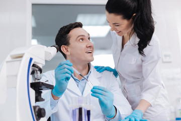 Obraz premium Positive practitioner looking at his young colleague