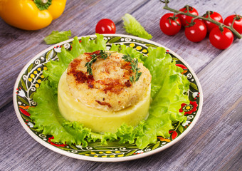Fish cake with mashed potato and lettuce