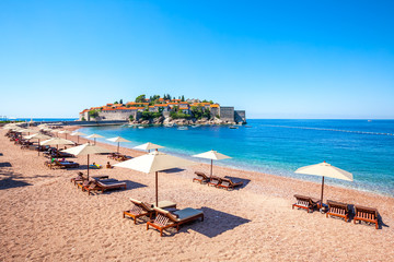Wonderful holiday in St. Stefan, Adriatic Sea, Sveti Stefan, old historical town and resort on the island. Montenegro - obrazy, fototapety, plakaty