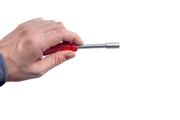Hand holding chrome industrial screwdriver with one bit extension and replaceable head