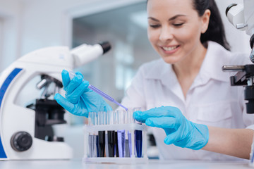 Portrait of pretty woman while working in lab
