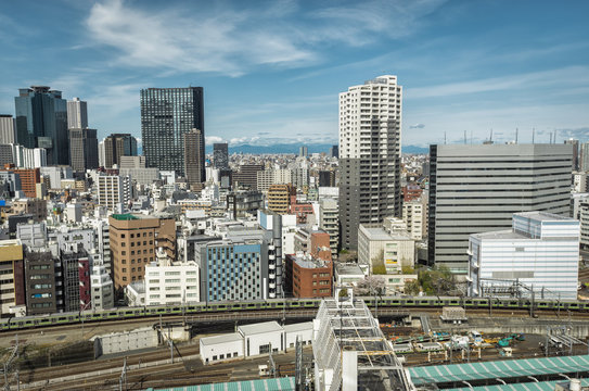 Tokyo skyscrapers in Shinjuku modern district, Japan. City train station visible
