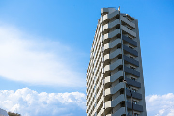 Blue sky and high-rise residential building in Japan