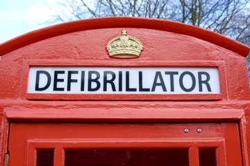 A Defibrillator being stored in a old style UK phone box for emergency use