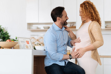 Obraz premium Mature couple feeling their baby moves